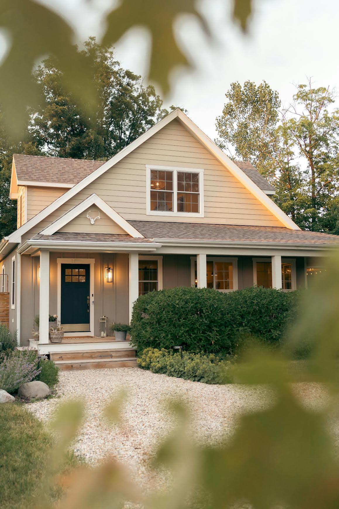 Texas home framed by trees at dusk